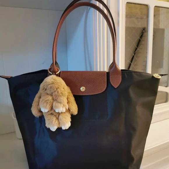 Longchamp Handbags - Longchamp Black Tote with Brown Trim and Tan Plush Charm